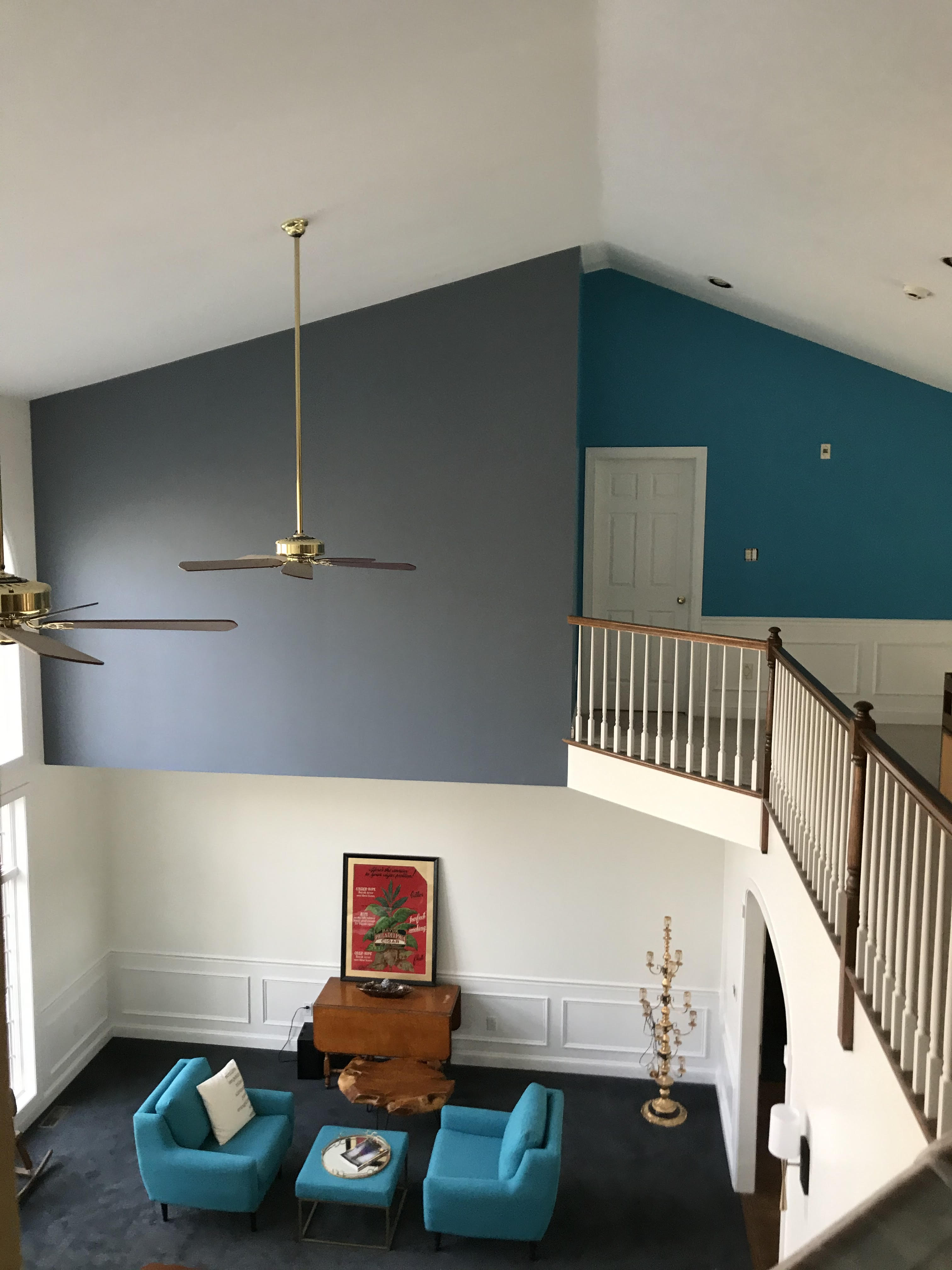 Stunning two-story vaulted ceiling with bold gray and teal paint transformation